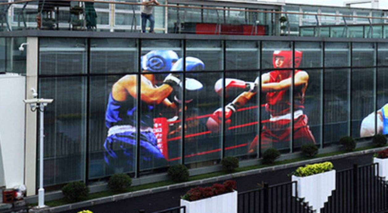 Shopping mall exterior with transparent LED grid screen